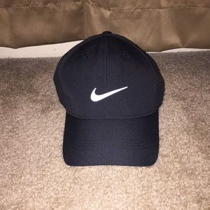 All black nike hat with white swoosh.