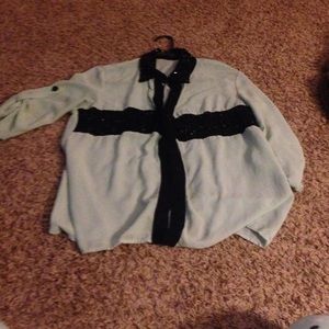 Small ink stain on upper right shoulder