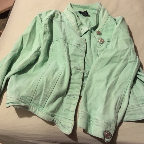 Mint green jacket.