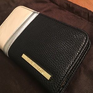 Steve Madden zip around tri leather wallet.
