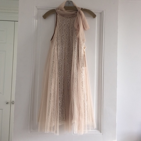 Beige lace dress with bow tie neck