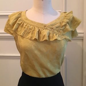 100% silk jacquard blouse.