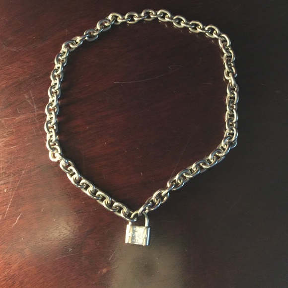 Tiffany sterling necklace with charm says t & co.,