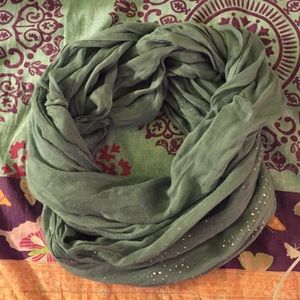 Blue infinity scarf with bedazzles on it