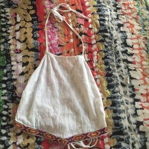 Halter top with pattern trimming at the bottom