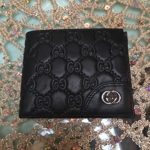 Black billfold Gucci wallet