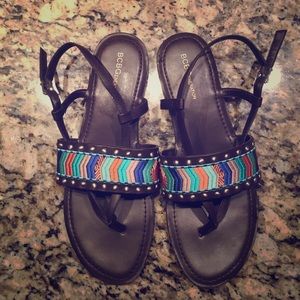 Dark brown sandals w/ colored pattern across top.