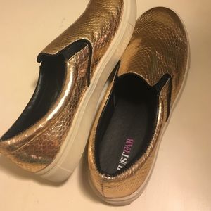 Never worn cute metallic gold slip on loafers.
