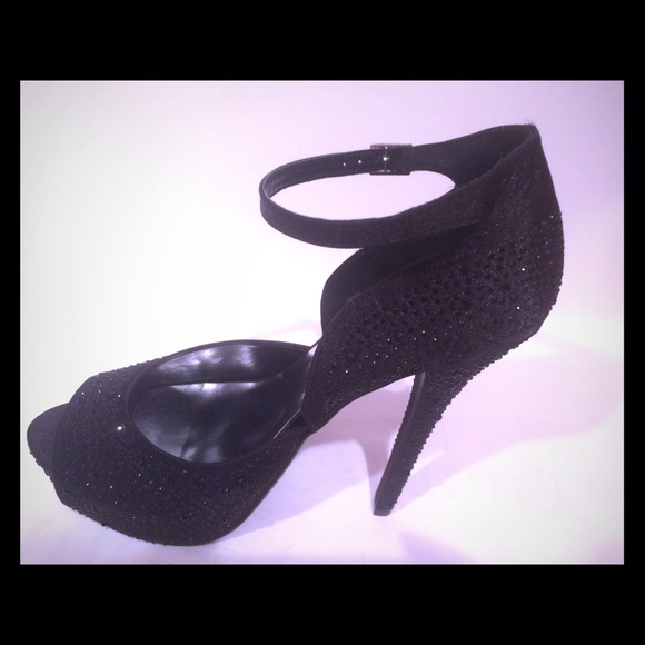 Black studded satiny heels. never worn Approx 6 in