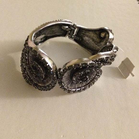Black and silver clamp bracelet.