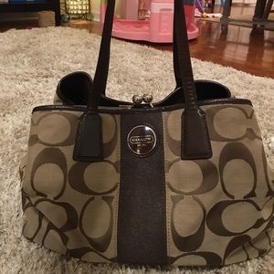 Coach purse with clasp close inside