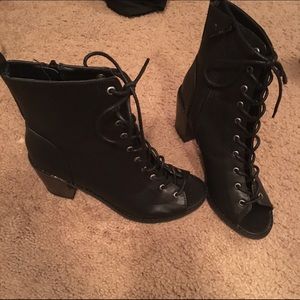 Black lace up Chelsea booties.