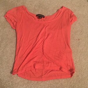 Coral colored crop top.