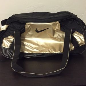 gold nike bag