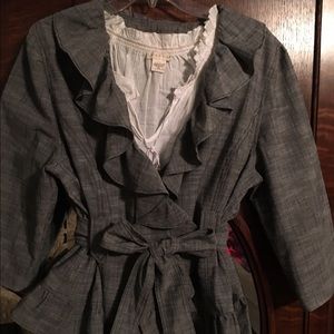 Gray jacket with self belt and ruffle detail.