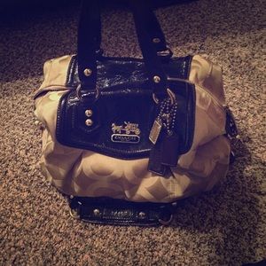 Coach purse. Used. Has a stain on the inside.