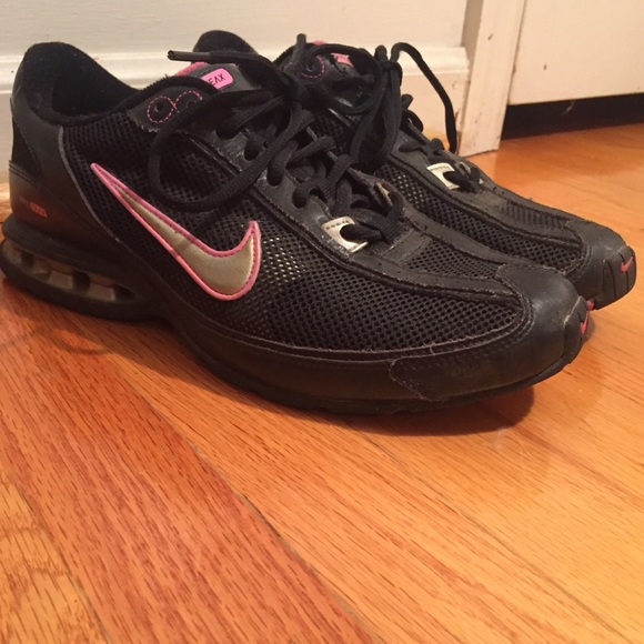 Black and pink women's Nike tennis shoes