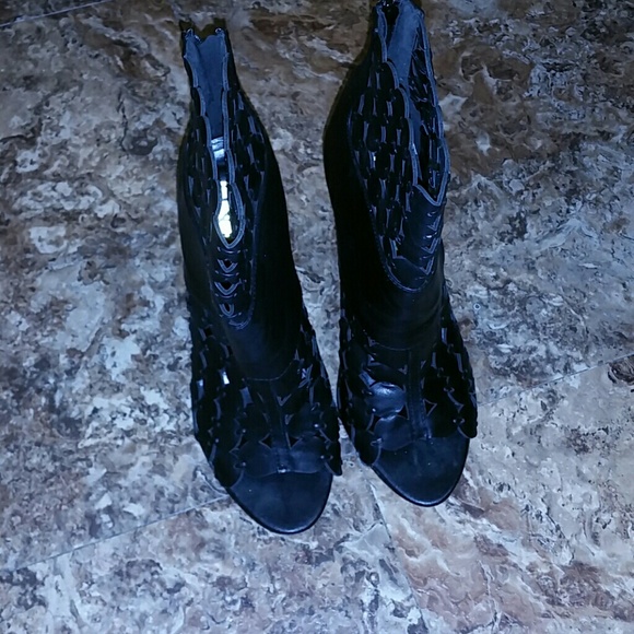 Black perforated booties worn twice