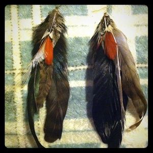 Long urban outfitter feather earrings!