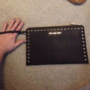 Michael kors dark brown big wristlet. NEVER WORN