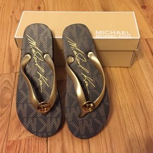 Brown and gold MICHAEL Michael Kors flip flops!