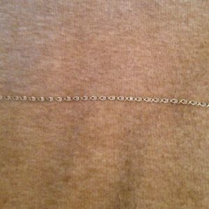 10k gold diamond tennis bracelet.