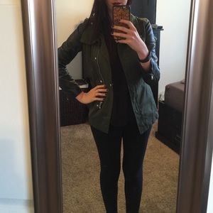 Army green jacket with black leather sleeves