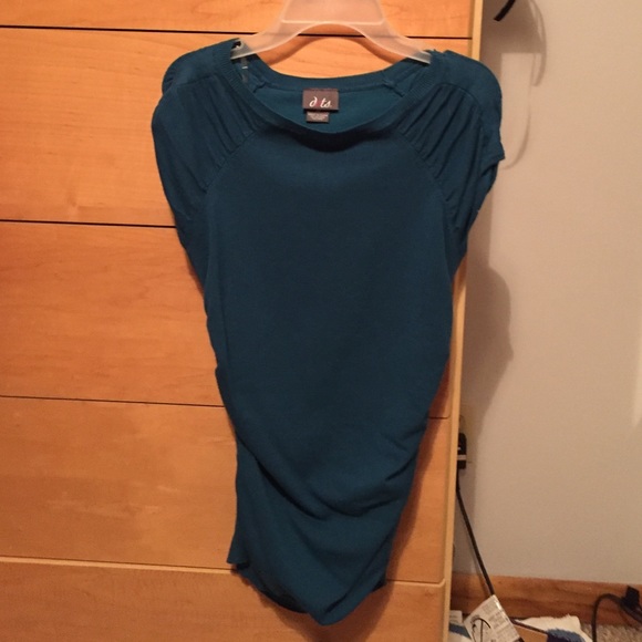 Teal shirt. Clingy.