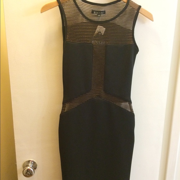 Black sleeveless dress with bronze accents.
