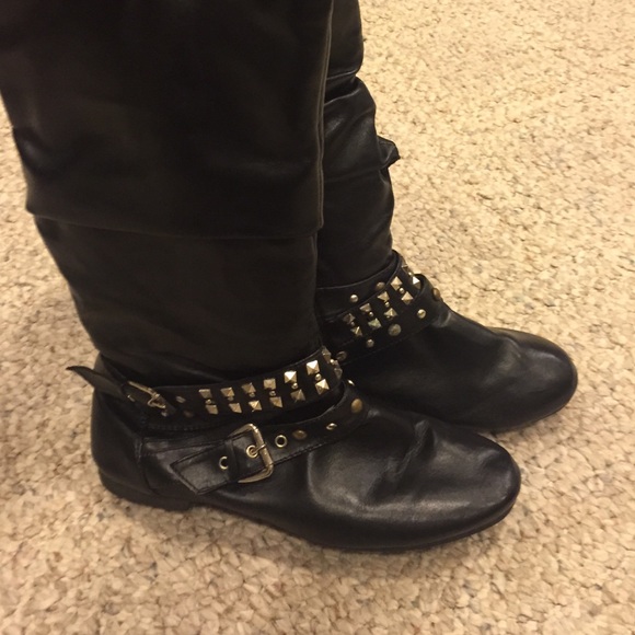 Tall black studded boots