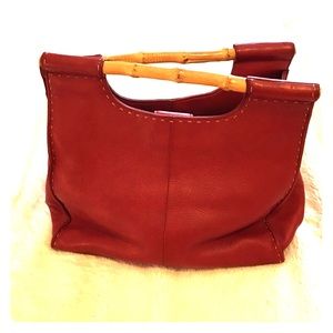 Fossil purse. Bright red with bamboo handles