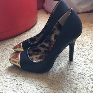 Gold capped black heels
