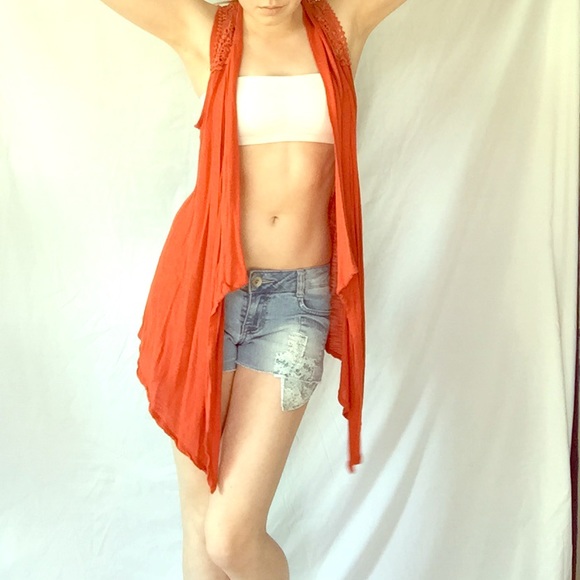 Orange bohemian type vest with lace detail.