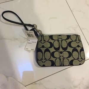 Coach wristlet with tags on and dust bag
