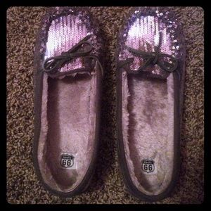 A pair of silver moccasins, brand new