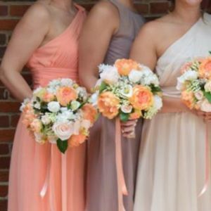 Coral dress all the way to the left. Donna Morgan.