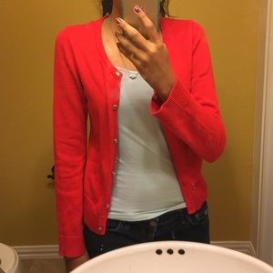 Bright red cardigan