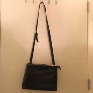 Faux leather black bag with buckle strap accent