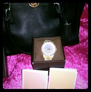 Gold Michael Kors watch.