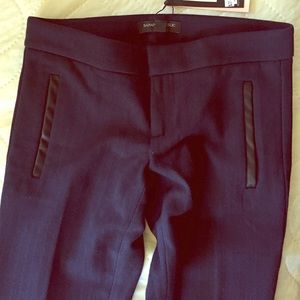 Navy stretch pants with leather detailing