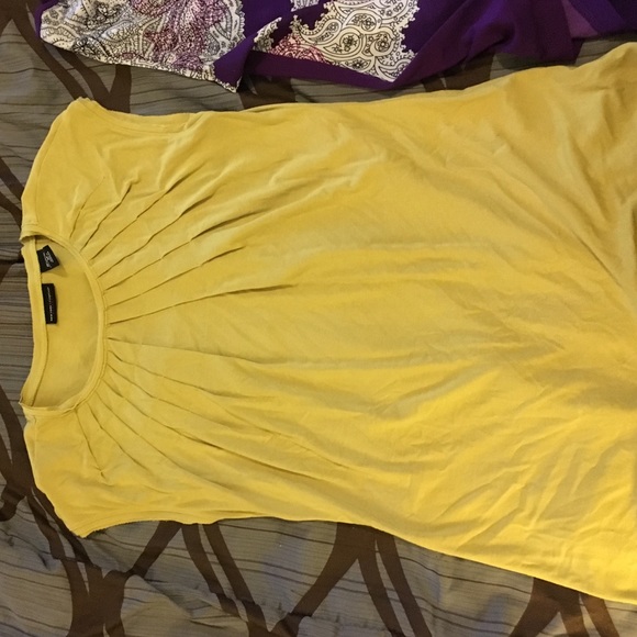 Shirts yellow is a medium and purple is a large