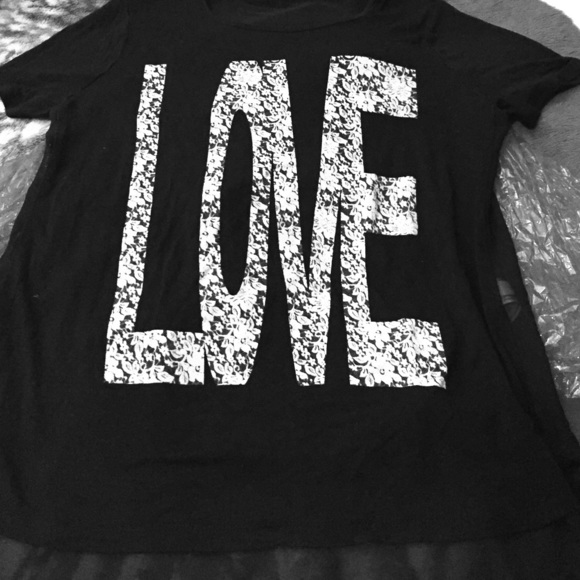 Short sleeved, black shirt, see through backside.