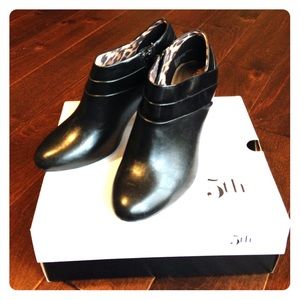 Black almond toe heeled ankle boots