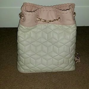 Pick and white leather backpack