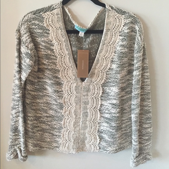 white & black V-neck sweater w/ crochet detail