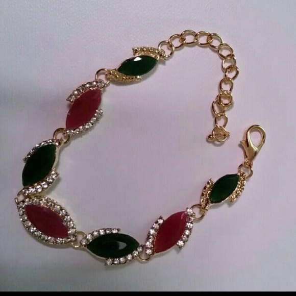 Ruby and emerald gold plated bracelet.