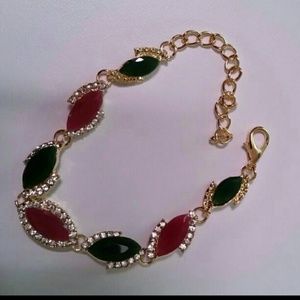 Ruby and emerald gold plated bracelet.