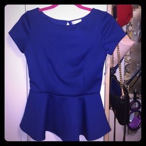 Blue neoprene like peplum top.