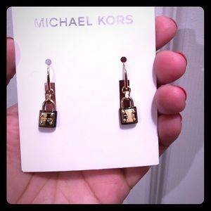 Michael kors lock earrings in gold and tortoise.