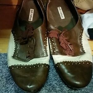 Brown and tan oxford flats